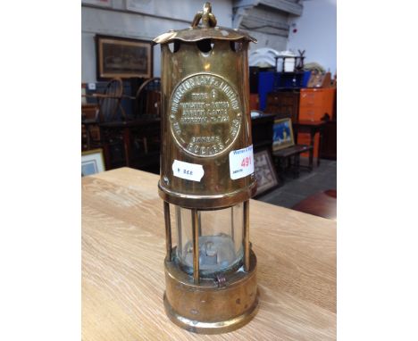 A BRASS MINER'S LAMP