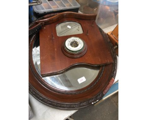 AN OVAL MIRROR AND A BAROMETER/MIRROR