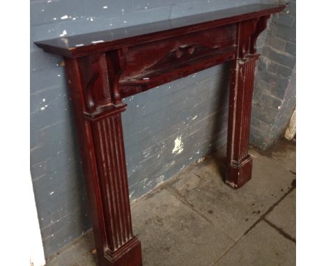A WOODEN FIRE SURROUND