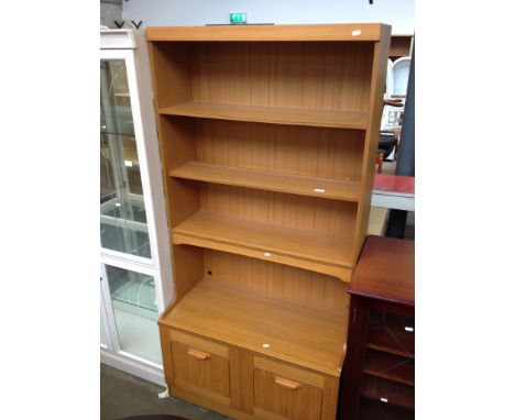 A LIGHT WOOD EFFECT BOOKCASE
