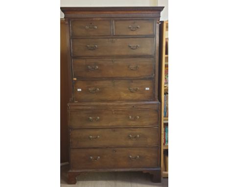 A George III mahogany chest on chest with a moulded dentil cornice above two short and three long drawers the base with a bru