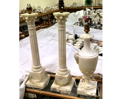 A pair of Corinthian column "Marble" candlestick style lamps and a "Marble" urn table lamp