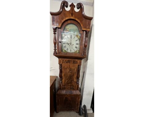 A 19th century mahogany longcase clock, the hood with broken swan neck pediment an baluster columns, with a short trunk door,