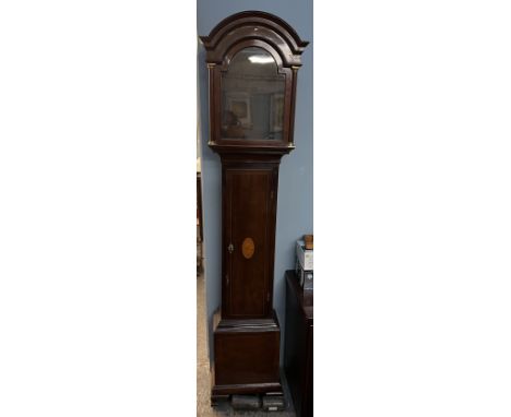 A 19th century mahogany long case clock case with an arched hood, the long trunk door with central fan on bracket feet with w