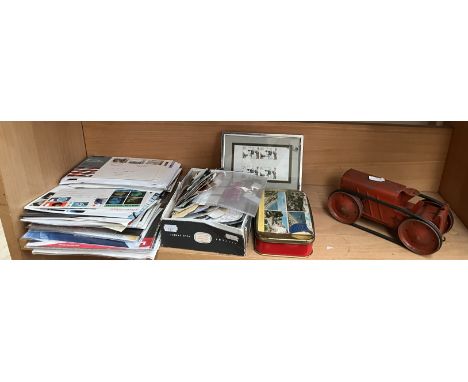 A tin plate wind up tractor together with a collection of loose stamps and first covers 