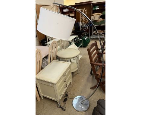 A chrome arching standard lamp