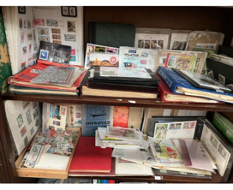 A large collection of world stamps, loose and in albums together with first day covers etc 
