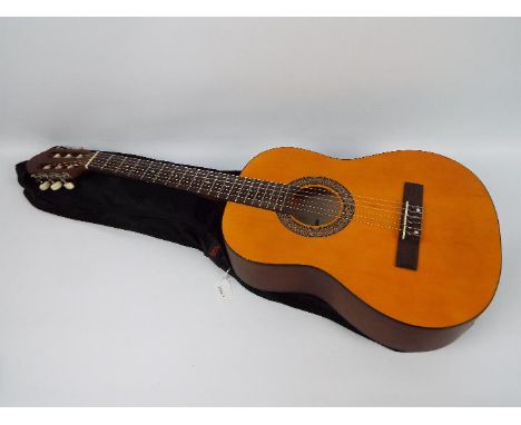 A Stagg classical guitar, model C430, in soft case.