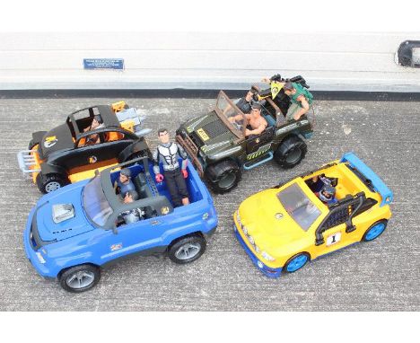 Action Man - A collection of 8 figures and 4 vehicles. 4 Action men figures - Soldiers and camera men with clothes and some a