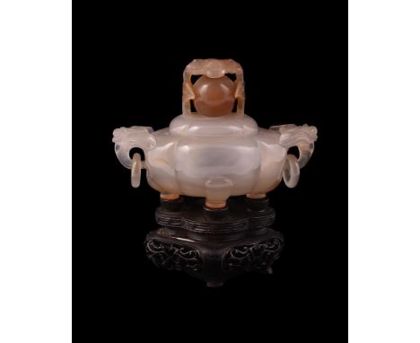 A Chinese agate censer and cover, Qing Dynasty, 19th century, of lobed form supported on four short feet, with flower and rin