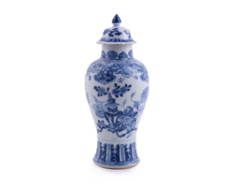 A Chinese blue and white vase and cover, Kangxi, painted to the sides with flower baskets, 28cm high清康熙 青花花卉博古纹盖瓶Condition Re