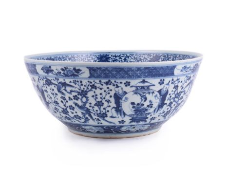 A Chinese blue and white punch bowl, Qing Dynasty, 19th century, the interior pained with a circular roundel of a dragon amon
