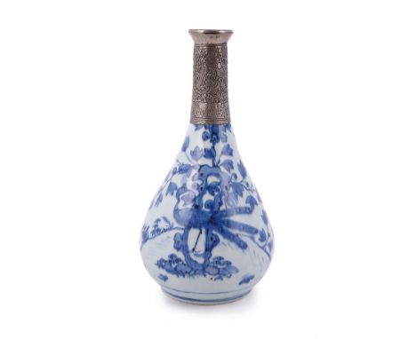 A Chinese blue and white vase, Ming Dynasty, 16th/17th century, painted to the pear-shaped body with peacocks perched on gard