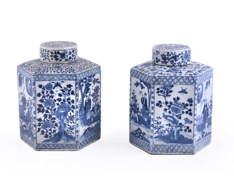 A pair of Chinese blue and white hexagonal tea caddies and covers, 19th century, painted to the sides with figures in landsca