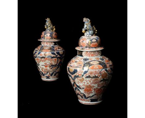 A pair of Japanese Imari vases and covers, Edo Period, late 17th century or early 18th century, of baluster form, decorated i