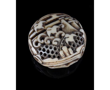 Y A Japanese Walrus Ivory Ryusa Manju Netsuke of typical rounded form, carved and pierced with chidori in flight over jakago 