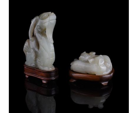 A Chinese pale celadon 'Twin cats' jade carving, Qing Dynasty, in the design of two coiled cats, 4.2cm long, with fitted wood