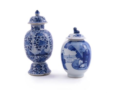 A small Chinese blue and white jar and cover, Kangxi, painted with two ladies and attendant in a landscaped garden, 13cm high