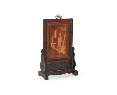 A large Chinese hongmu and boxwood table screen, 20th century, carved in box wood with a lady leaning on an alter table under