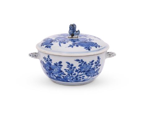 A Chinese blue and white tureen with cover, Kangxi, painted in underglaze blue with flowers and foliage, with Bluett and sons