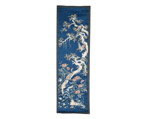 An attractive Chinese silk scroll embroidery, Qing Dynasty, circa 1820, depicting twinned cranes perched in a pine tree, all 