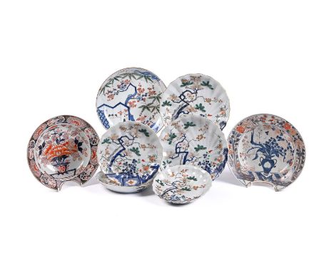 A Japanese Arita porcelain Barber's Bowl of typical circular form, decorated in Imari style with an ikebana arrangement withi