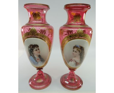 PAIR OF BOHEMIAN RUBY OVERLAY GLASS VASES of baluster form, spreading circular feet, overlaid in white with single oval panel