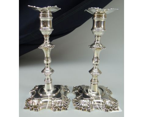 PAIR OF GEORGE II CAST SILVER CANDLESTICK HOLDERS with decorative bases and knopped stems, removable sconces (sconces non-hal