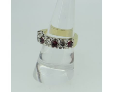 YELLOW AND WHITE METAL SIX STONE DIAMOND AND RUBY RING, the three diamonds approximately 0.45cts overall, 9.7gms.