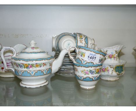 A pretty blue, white, and floral part Teaset by Crown Staffordshire including six cups, saucers, and plates and a teapot plus