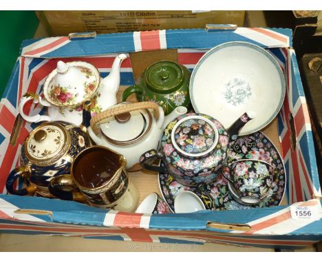 A quantity of teapots including Royal Albert Country Roses, Imari style teapot, stand and jug, oriental teapot with matching 