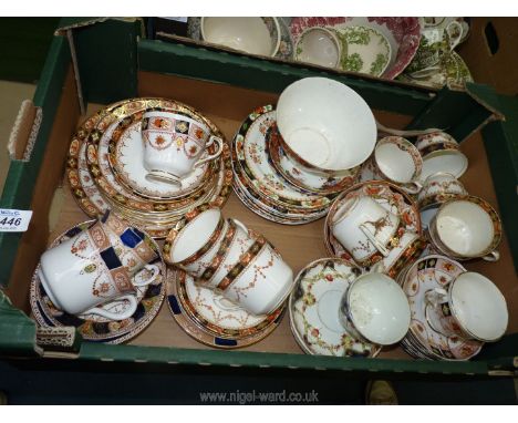 A quantity of Imari style china in various patterns including cups, saucers, plates and bowl.