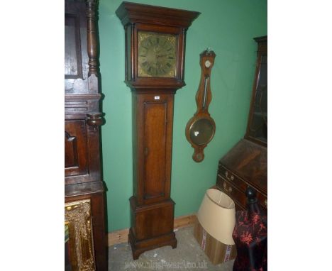 An Oak longcase Clock having a 30 hour movement with external count-wheel, striking the hours on a ball, the brass face with 