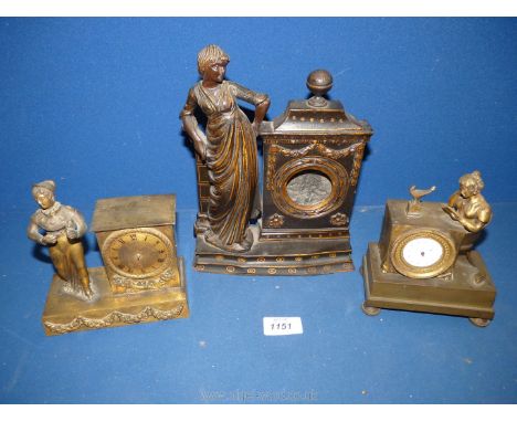 Two gilt finished metal mantle Clocks, one depicting young lady sitting and reading book at a table (table containing clock f