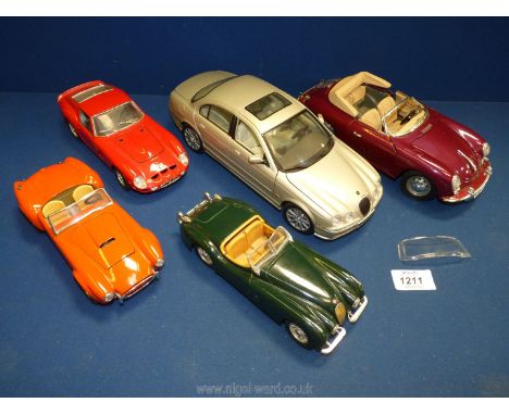 Five model cars including Burago Porsche 356B, Jaguar XK 120, Cobra 427, Ferarri 250 GTO plus a 1/18 scale Jaguar S type by M