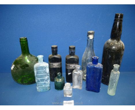 A quantity of old bottles including two Robertson's manuscript ink bottles (full), Hansard glass bottle from Abergavenny, etc