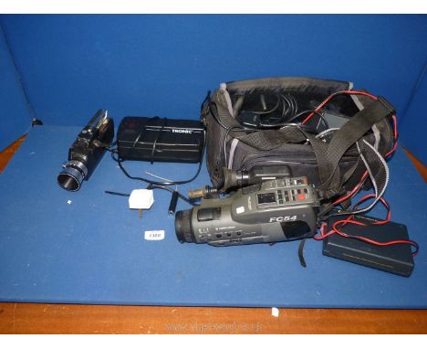 A Ferguson FC54 VHS-C Video Camera with various accessories, A Canon BC-E1 Battery Coupler, A Tronic Universal Ni-cd &amp; Ni