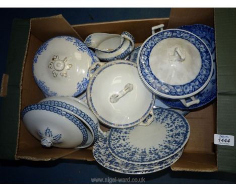 A quantity of blue and white china including tureens, gravy jug, meat plate and plates, one plate by Royal Worcester.