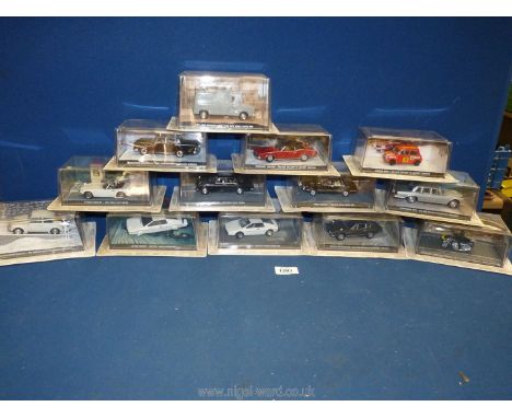 A box containing a quantity of 1:43 scale car models from 'The James Bond Car Collection', featured in the films 'The Spy Who