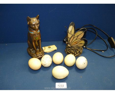 A Tiffany style small side light, butterfly shape, modern metal Egyptian cat and six alabaster eggs.