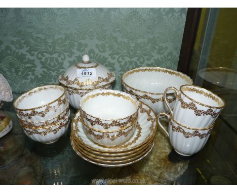 A small quantity of early Crown Derby teaware in white with gilt flower garland borders including 5 tea bowls, and saucers, 2