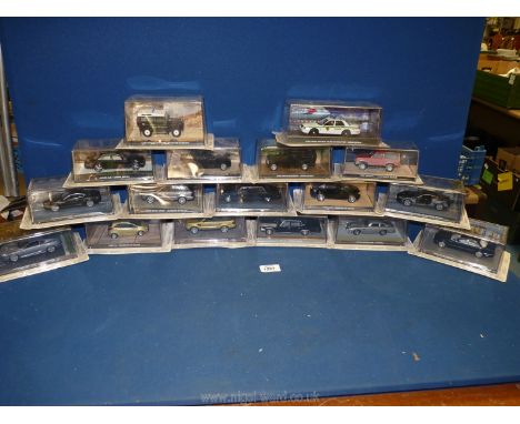 A box containing a quantity of 1:43 scale car models from 'The James Bond Car Collection', featured in the films 'Quantum of 