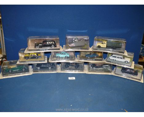 A box containing a quantity of 1:43 scale car models from 'The James Bond Car Collection', featured in the films 'Dr. No' and