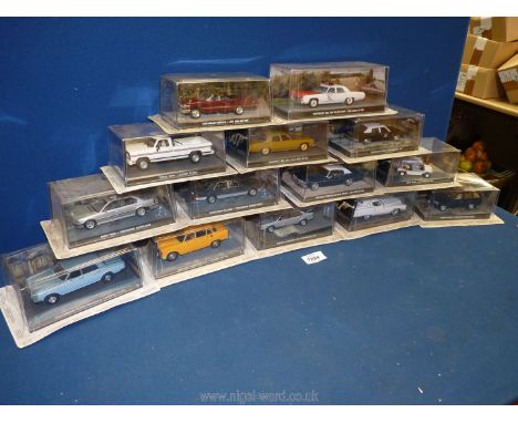 A box containing a quantity of 1:43 scale car models from 'The James Bond Car Collection', featured in the films 'Live and Le