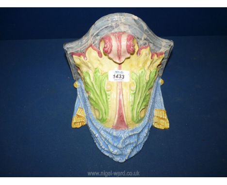 A large 19th Century Majolica ceramic wall bracket in bold colours and elaborate shape, possibly continental, 11" tall, some 