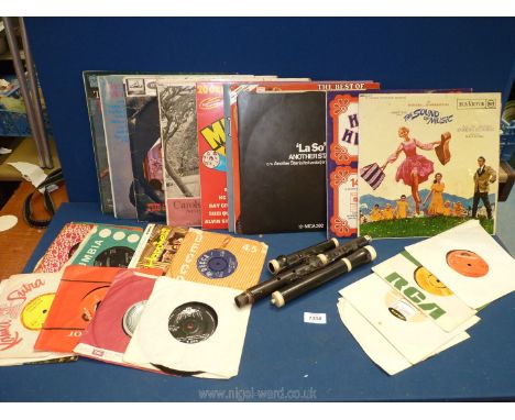 A vintage clarinet (mouth piece missing) together with mixed records to include 'the Sound of Music,' 'Top of the Pops,' and 