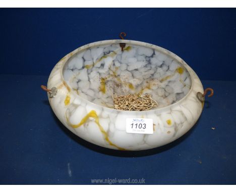 A yellow veined glass light shade.