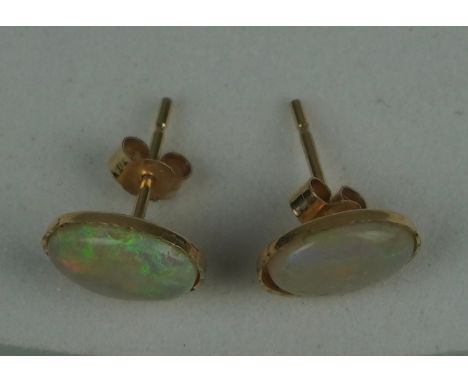 A PAIR OF OPAL EARRINGS SET IN 9CT GOLD, Total weight: 0.72gms10mm x 0.6mm each. 