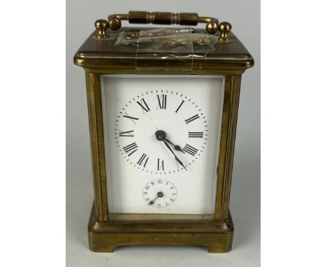 A FRENCH BRASS CARRIAGE CLOCK,One glass side missing. 