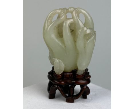 A 19TH CENTURY CHINESE WHITE JADE CARVING OF A BUDDHA'S HAND CITRON, 5cm x 3.8cm On later rosewood stand. Provenance: Purchas